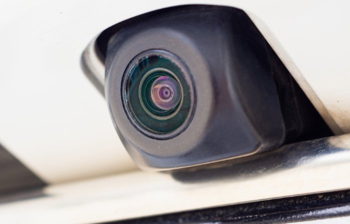 Backup camera mounted above the rear bumper of a car