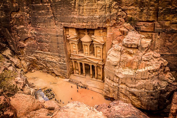 photo looking down at the carved pillars of Petra in Jordan